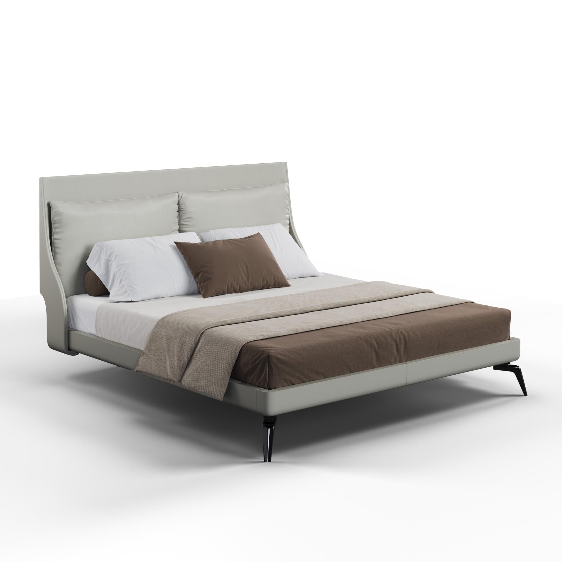A gray upholstered bed with curved side panels and black chrome legs, with bedding and pillows on it.