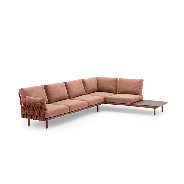 A modular sofa with a brown fabric upholstery, featuring a powder-coated aluminum structure and handmade wicker armrests and legs.
