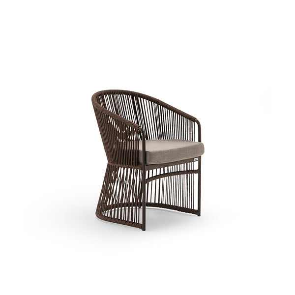 A slender, hourglass-shaped outdoor dining chair with a painted metal structure and synthetic fiber rope weave, featuring a gray structure with a gray cushion.