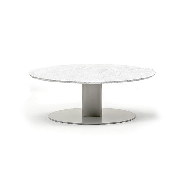 A large round coffee table with a cylindrical stem, featuring a white surface and a silver steel base.