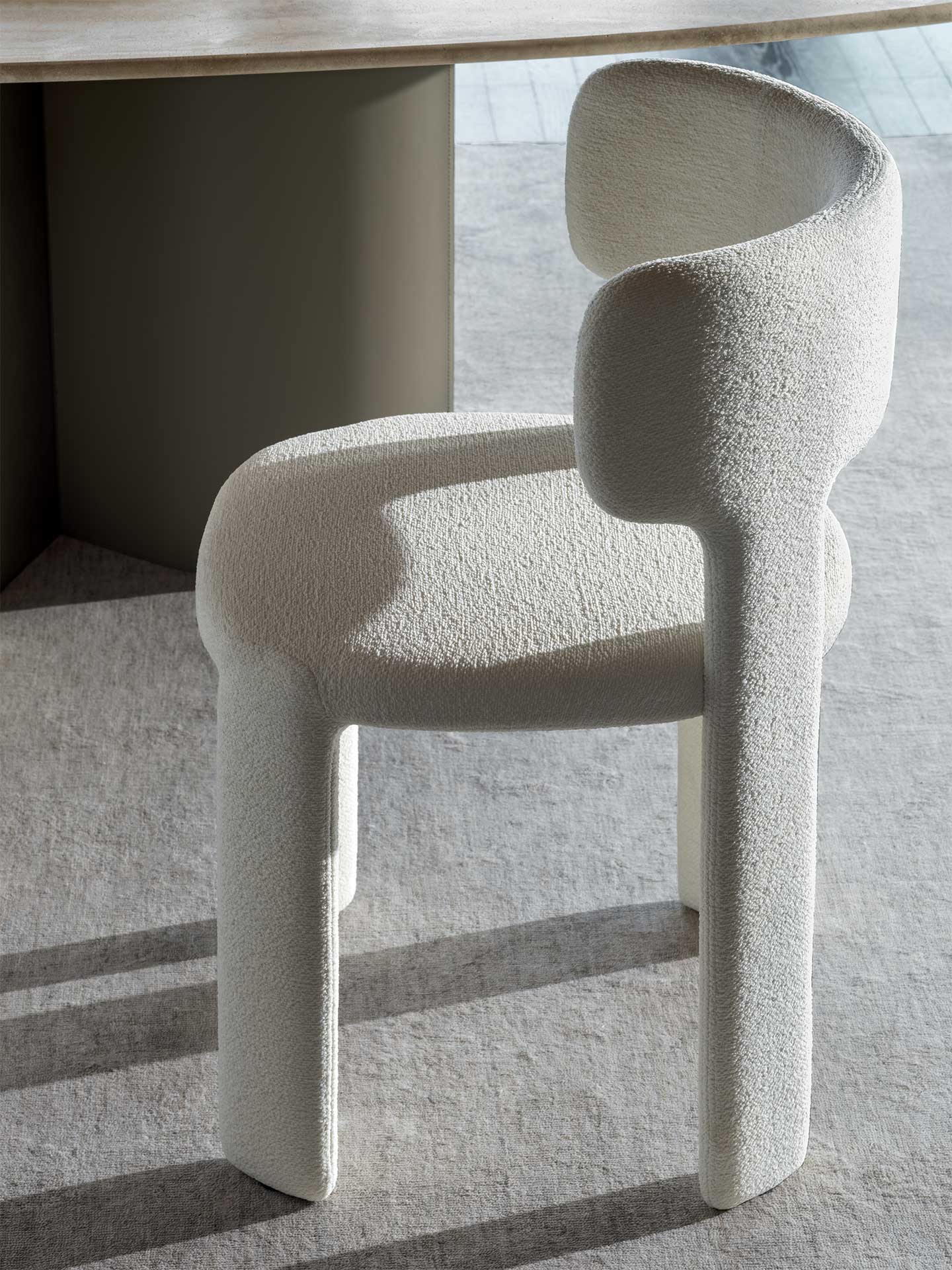 Modern chair with textured design on a light gray floor